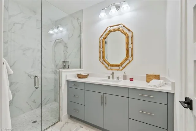 a bathroom with a double vanity sink and a mirror