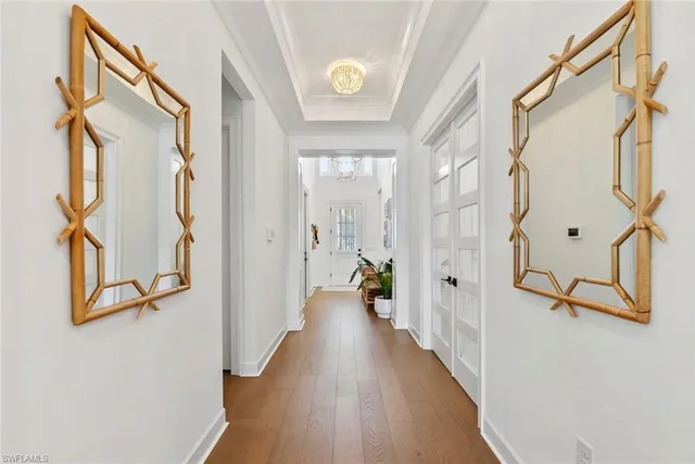 a view of an entryway with wooden floor