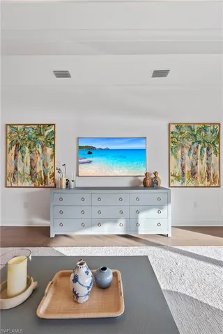 a living room with hard wood floors and a couch