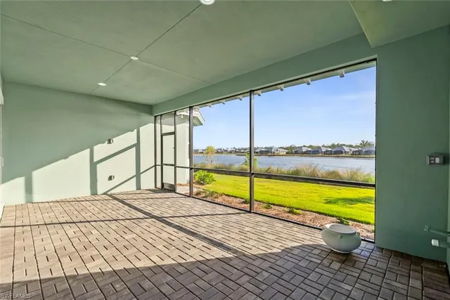 a view of an empty room with a large window