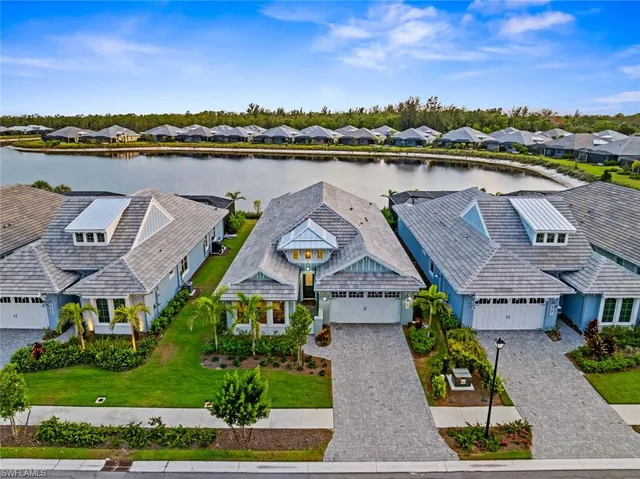 an aerial view of a house with a ocean view