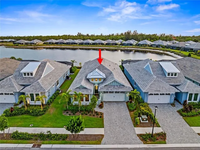 an aerial view of houses with yard