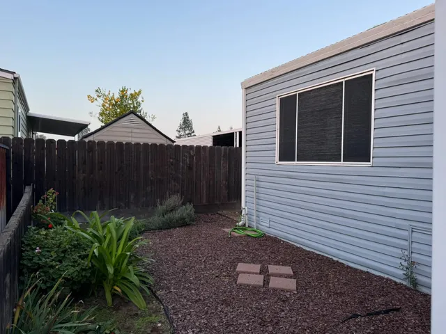 a view of a backyard with a garden