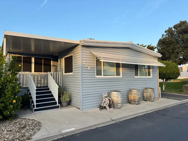 a front view of a house with stairs