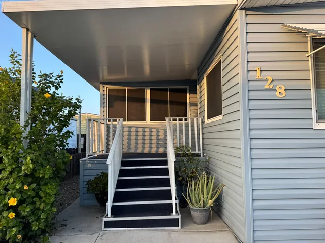 a view of a house with stairs and wooden floor