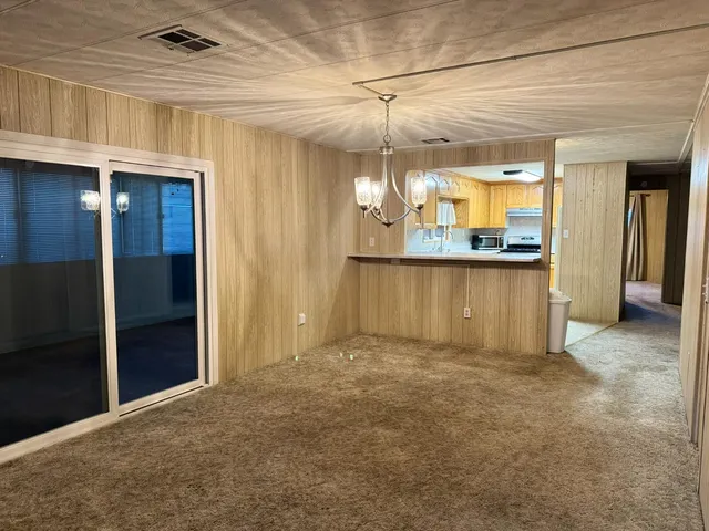 a view of a kitchen and a window