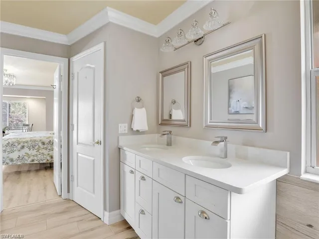 a en suite bathroom with a sink and a mirror