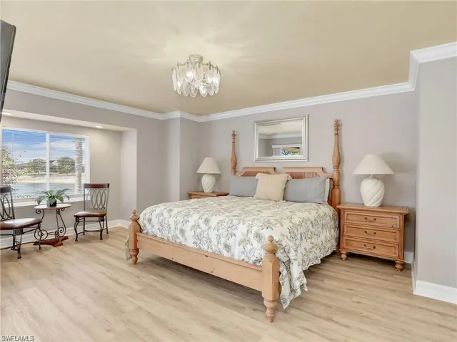 a spacious bedroom with a bed and window