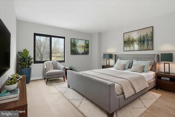 a bedroom with a bed and a couch