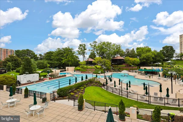 a view of a backyard with table and chairs