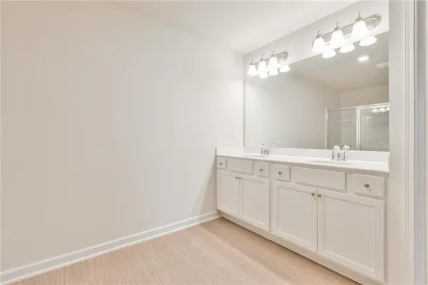 a bathroom with a sink vanity and a mirror