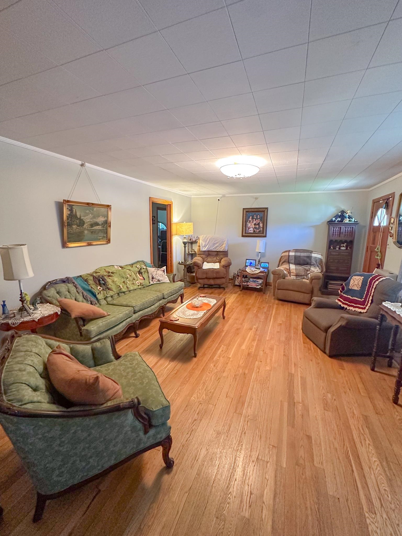 1650 6th Street Cherokee, AL 35616 - Photo 6 of 12 a living room with furniture and wooden floor