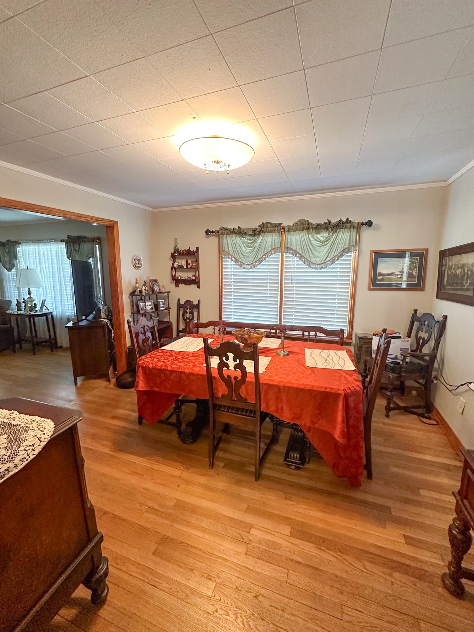1650 6th Street Cherokee, AL 35616 - Photo 8 of 12 a bedroom with a bed and wooden floor