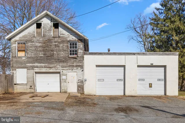 a front view of a house with garage