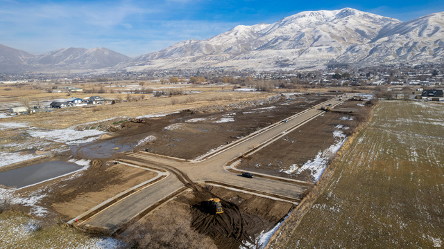 1380 West 2350 South, Unit 16 Perry, UT 84302 - Photo 24 of 25 Snowy aerial view featuring a mountain view