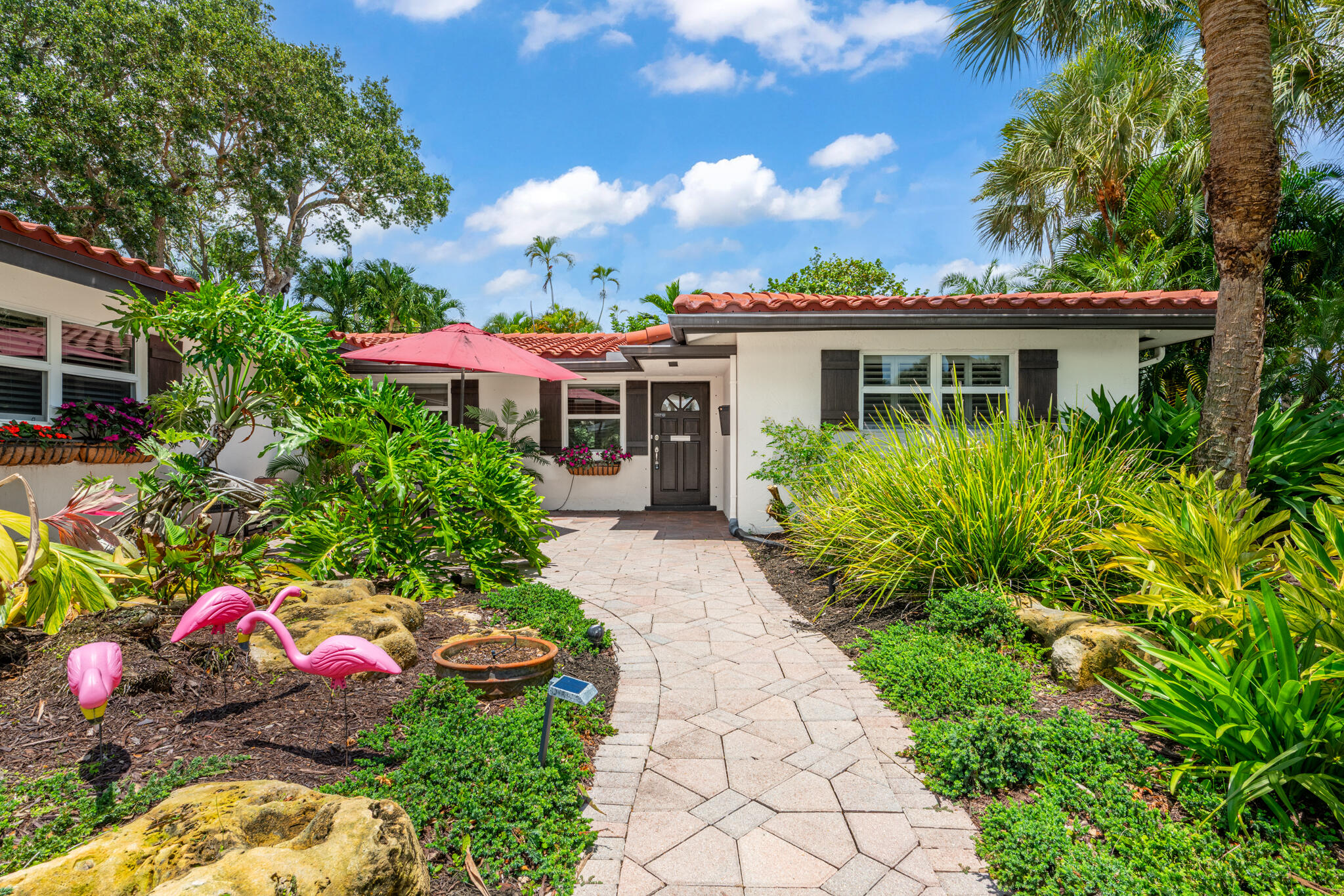 701 Southwest 5th Street Boca Raton, FL 33486 - Photo 1 of 19 a view of a house with a yard and garden