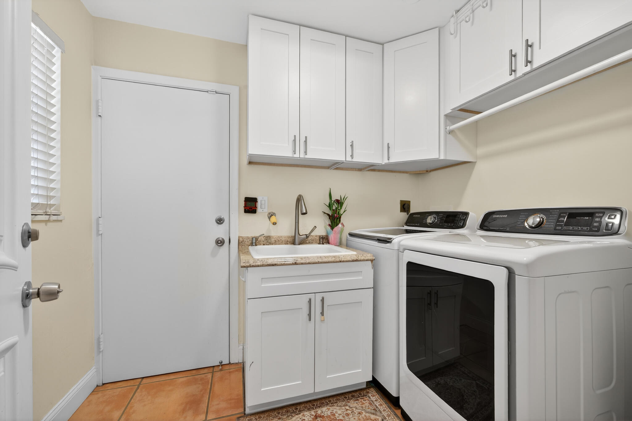 701 Southwest 5th Street Boca Raton, FL 33486 - Photo 12 of 19 a utility room with sink dryer and washer