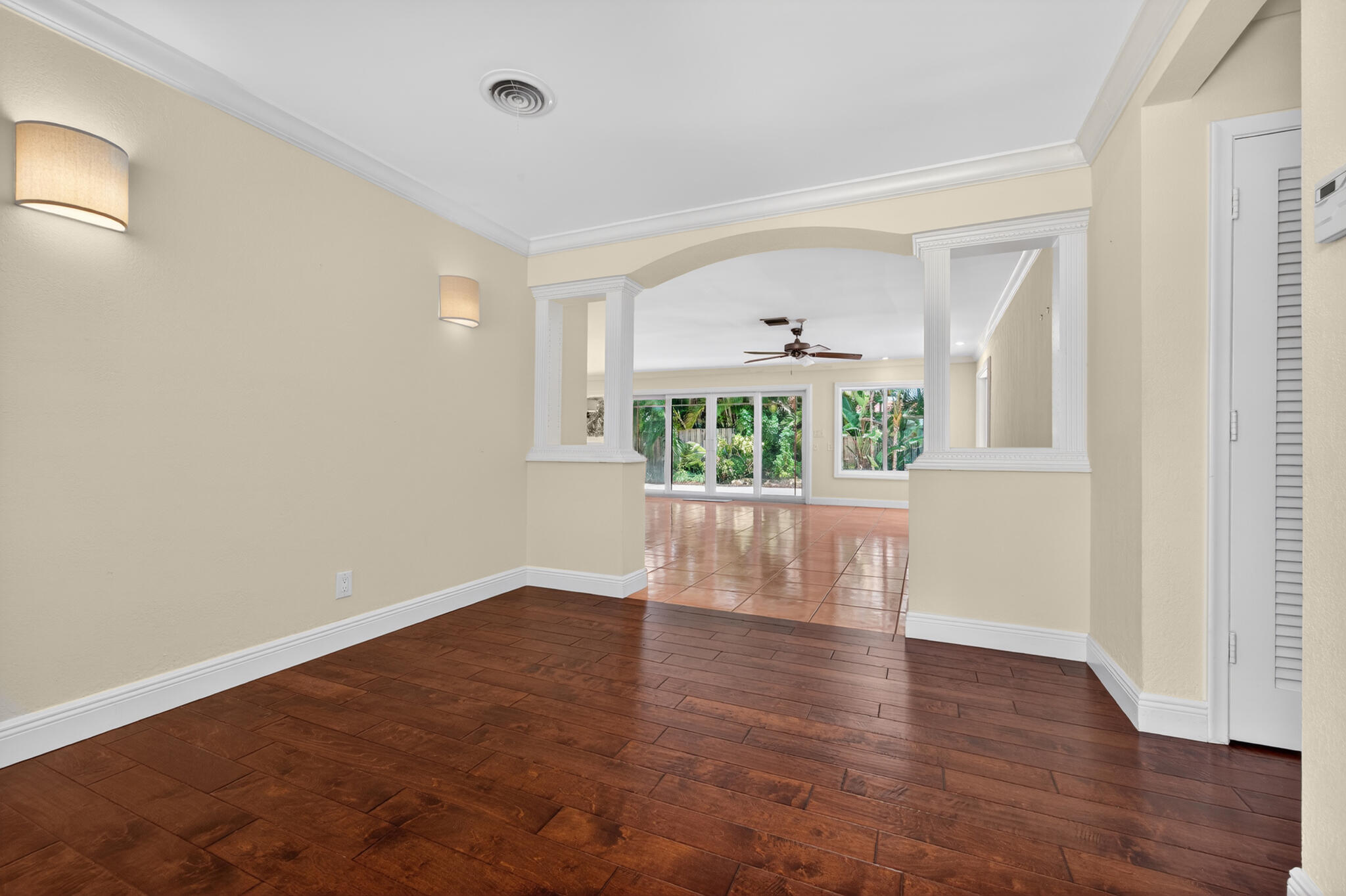 701 Southwest 5th Street Boca Raton, FL 33486 - Photo 15 of 19 an empty room with wooden floor and windows