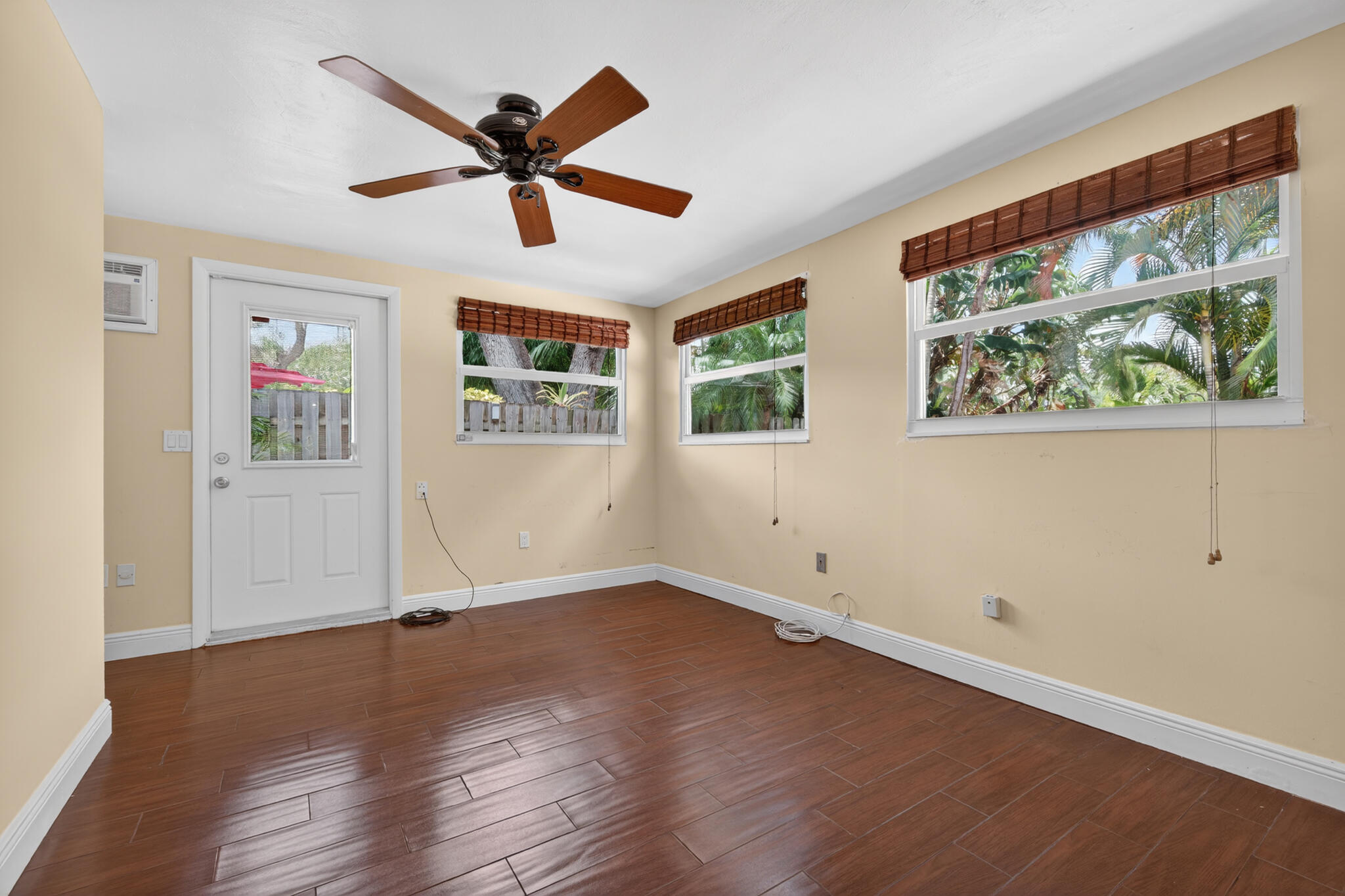 701 Southwest 5th Street Boca Raton, FL 33486 - Photo 17 of 19 a view of empty room with wooden floor and fan