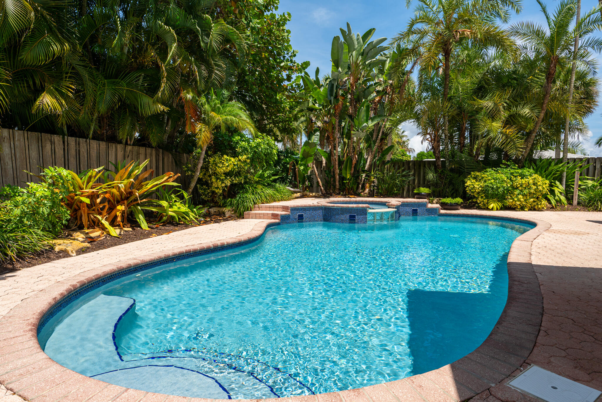 701 Southwest 5th Street Boca Raton, FL 33486 - Photo 4 of 19 a view of a swimming pool with a yard and sitting space