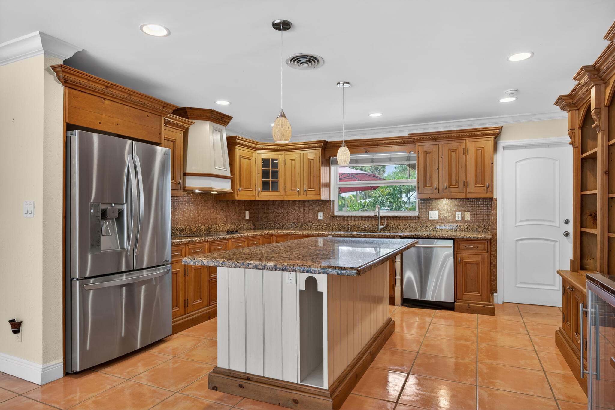 701 Southwest 5th Street Boca Raton, FL 33486 - Photo 9 of 19 a kitchen with stainless steel appliances granite countertop a refrigerator and a sink