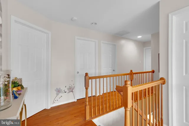 a bedroom with a bed and a potted plant