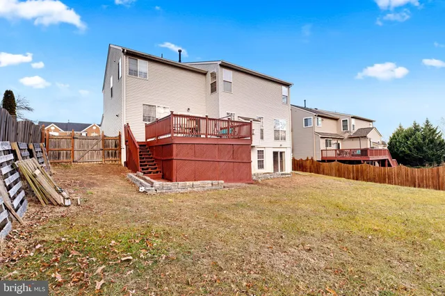 an aerial view of a house with swimming pool and sitting space
