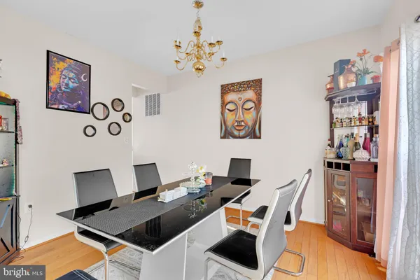 a work room with furniture and wooden floor