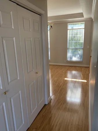 a view of an empty room with a ceiling fan