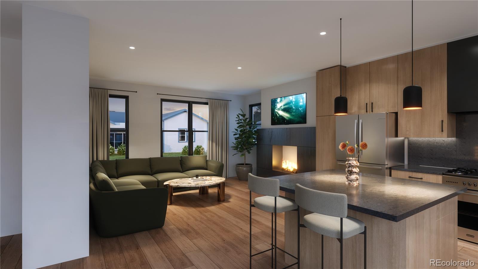 6408 Quitman Court Arvada, CO 80003 - Photo 4 of 11 a living room with furniture a flat screen tv and a fireplace