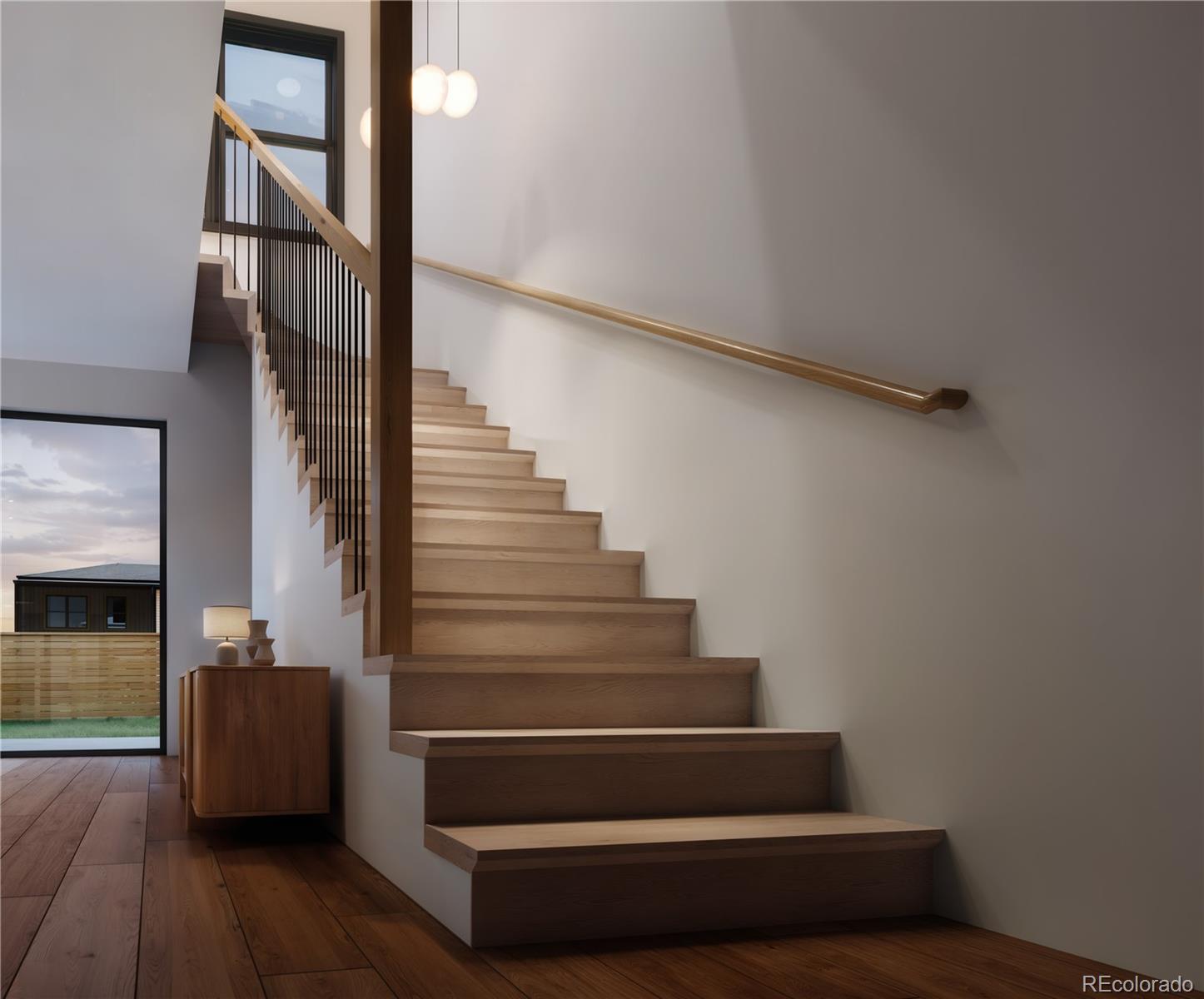 6408 Quitman Court Arvada, CO 80003 - Photo 5 of 11 a view of entryway and hall with wooden floor