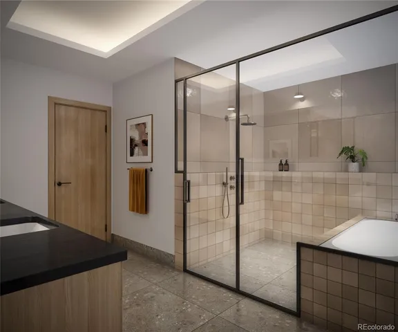 a bathroom with a granite countertop sink mirror and shower