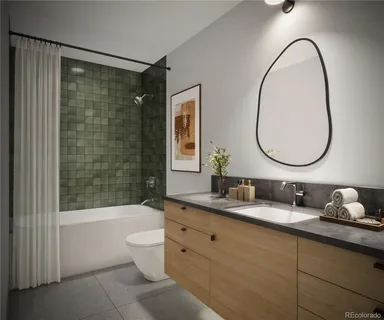 a bathroom with a granite countertop toilet a sink and a mirror