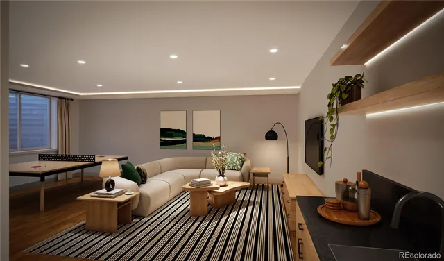 a living room with furniture and a wooden floor