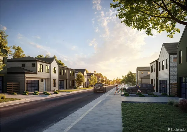 a view of multiple houses with a street
