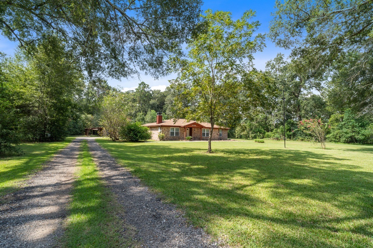 Feel the warmth and peace when pulling into this gated property surrounded by beautiful trees and nature.