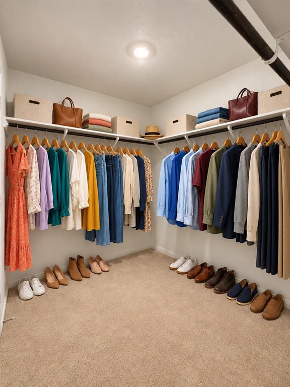 11726 Bone Spg Drive Rhome, TX 76078 - Photo 17 of 29 *Virtually Staged* Spacious primary walk-in closet featuring wraparound hanging rods, overhead shelving, recessed lighting, and ample storage space.