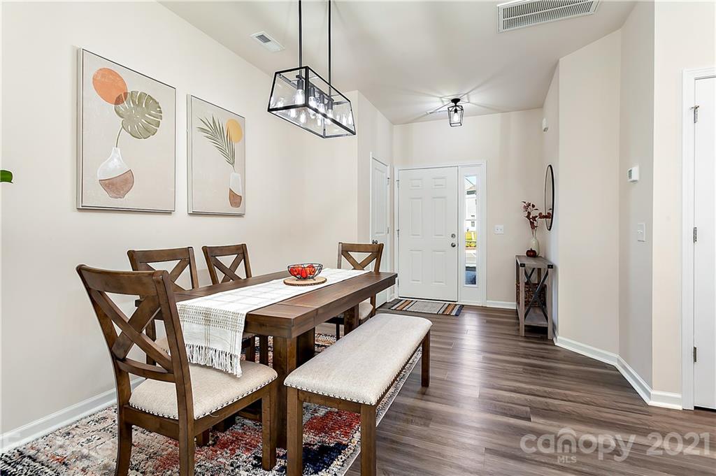 501 Hunters Dance Road Fort Mill, SC 29708 - Photo 2 of 16 a view of a dining room with furniture and wooden floor