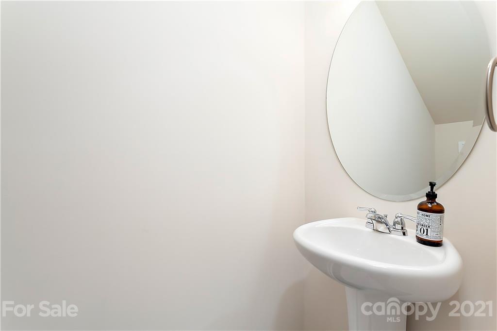 501 Hunters Dance Road Fort Mill, SC 29708 - Photo 6 of 16 a bathroom with a sink a mirror and vanity