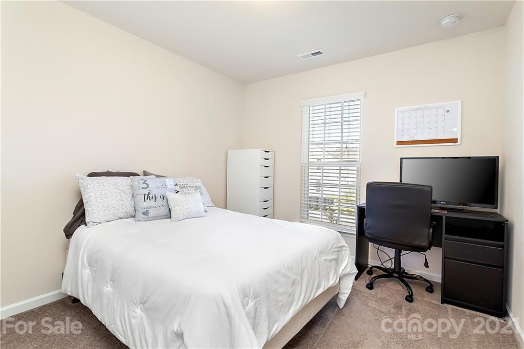 501 Hunters Dance Road Fort Mill, SC 29708 - Photo 10 of 16 a bedroom with a bed tv and chair