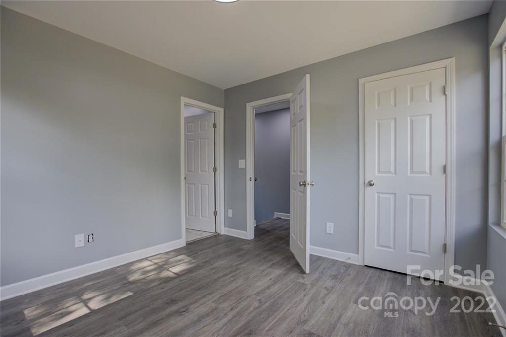 1129 5th Street Lancaster, SC 29720 - Photo 25 of 37 a view of an empty room with wooden floor and closet