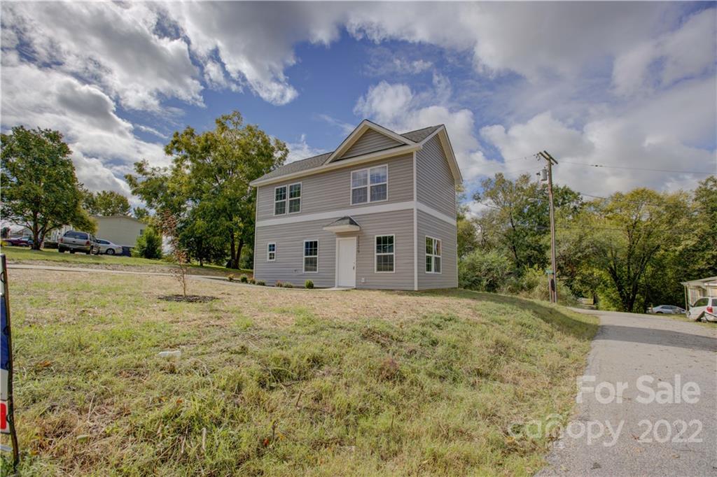 1129 5th Street Lancaster, SC 29720 - Photo 27 of 37 a house with trees in front of it