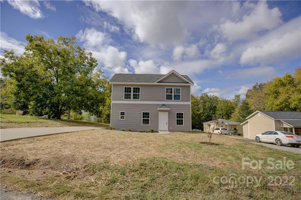1129 5th Street Lancaster, SC 29720 - Photo 3 of 37 a view of a house with a yard and a large tree