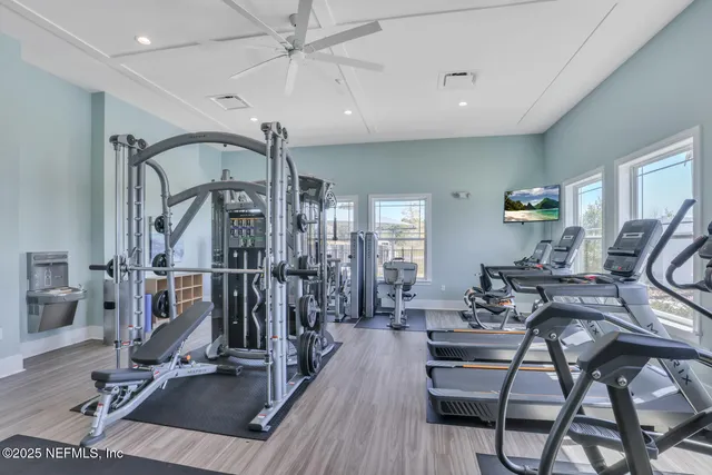 a view of a hall with furniture