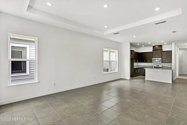 a view of a kitchen with a sink cabinets and a window