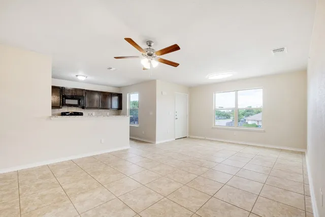 a view of a kitchen with microwave and cabinets