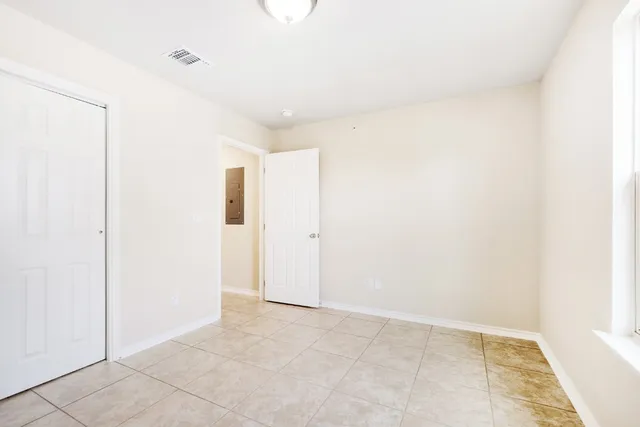 a view of front door and deck of the house