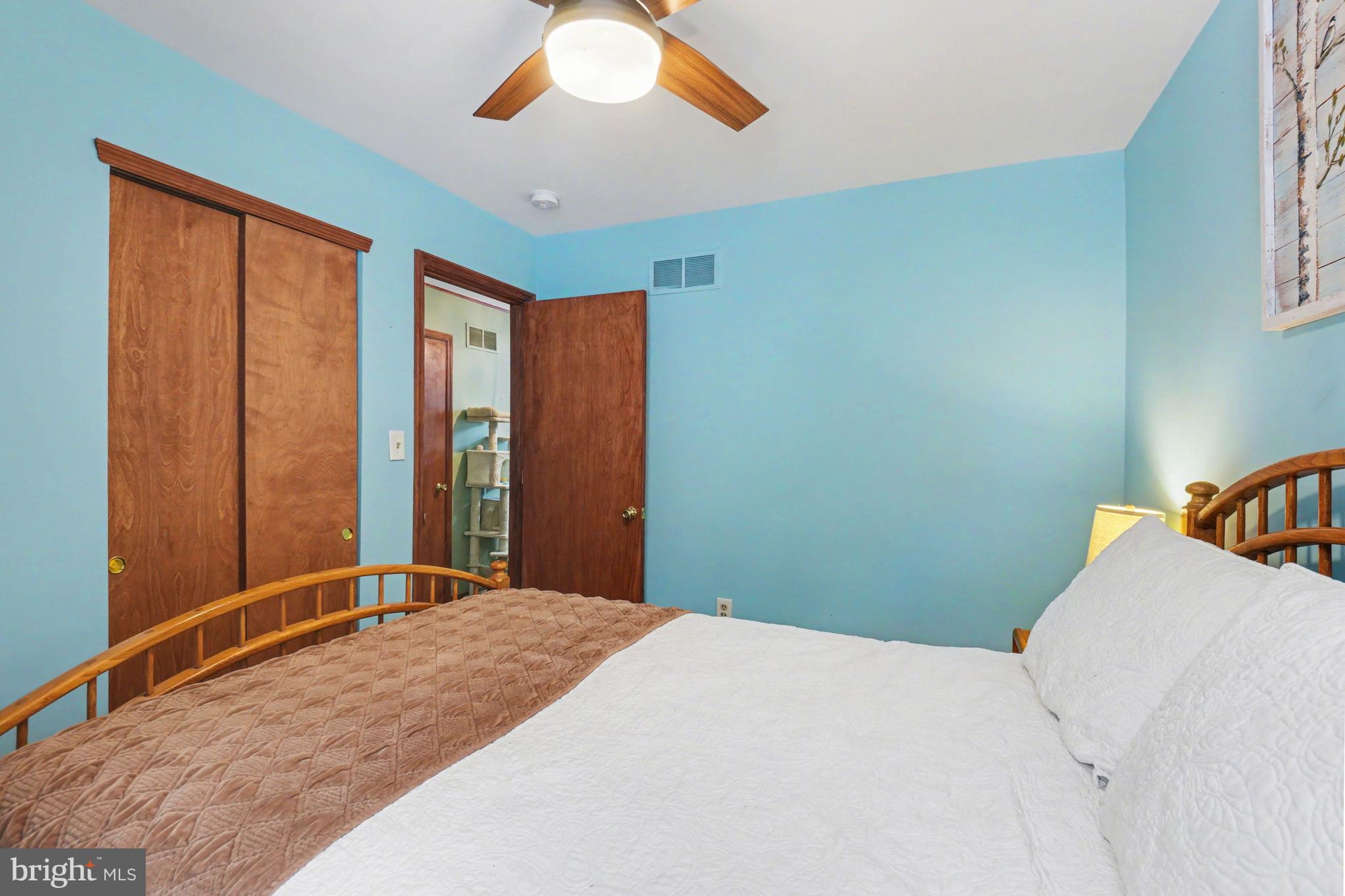 46 Wetzel Road Macungie, PA 18062 - Photo 20 of 42 a bedroom with a large bed and a chandelier