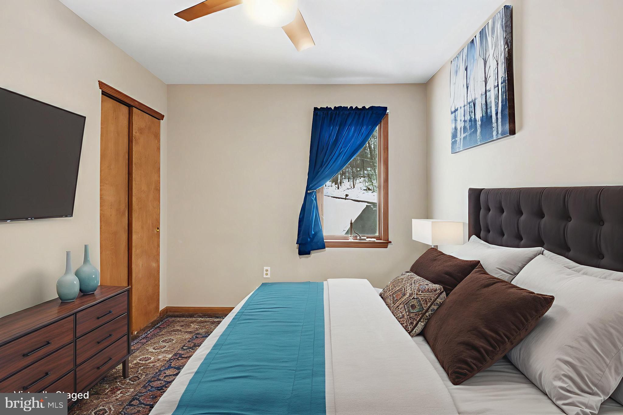 46 Wetzel Road Macungie, PA 18062 - Photo 24 of 42 a large bedroom with a bed and flat screen tv