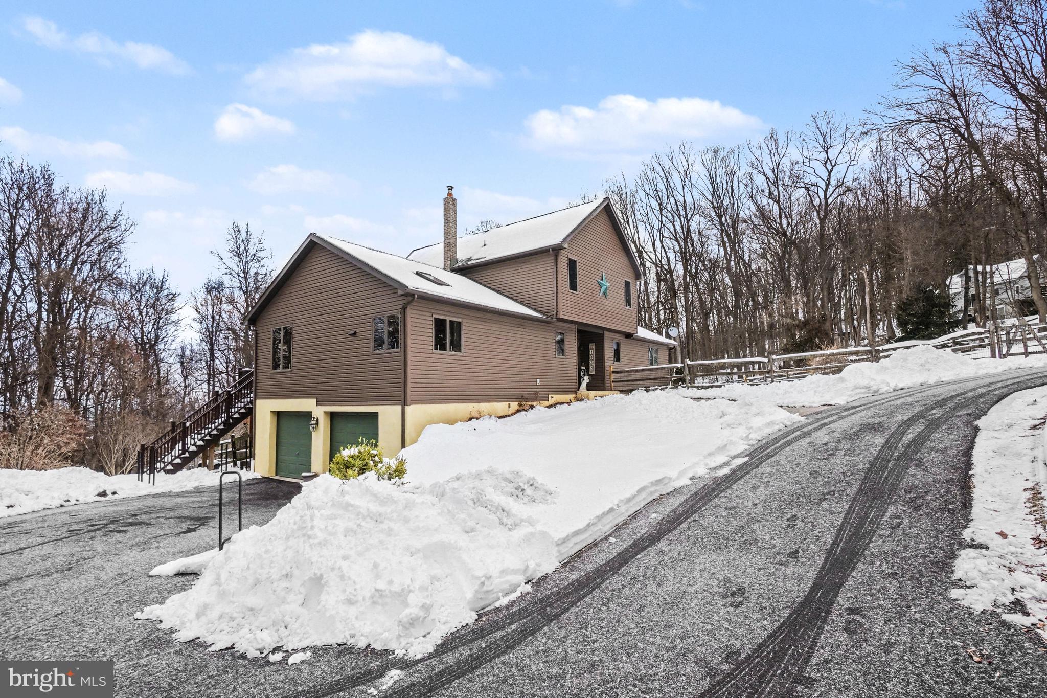 46 Wetzel Road Macungie, PA 18062 - Photo 30 of 42 a view of a house with a yard covered in snow